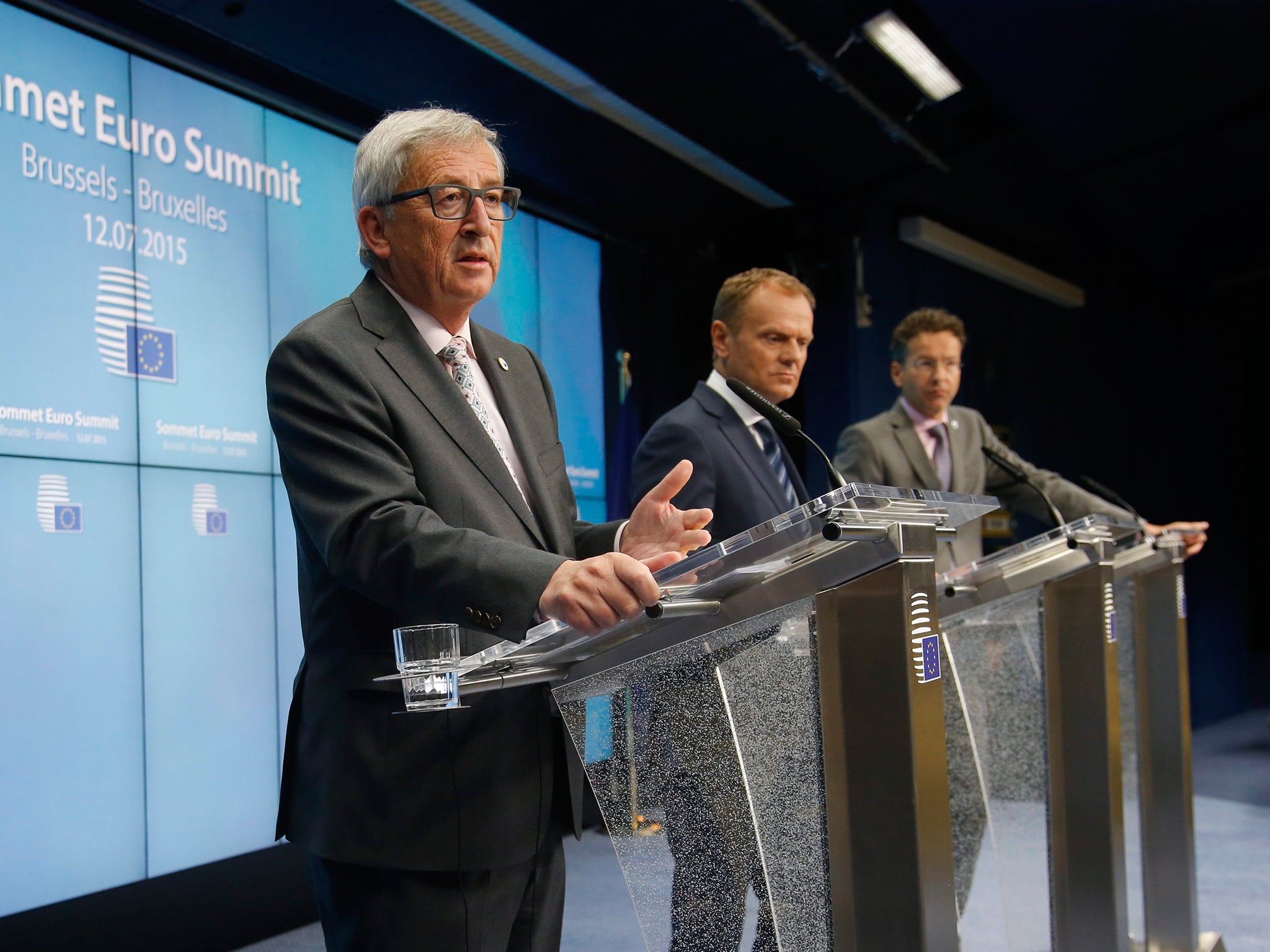 European Commission President Jean-Claude Juncker (L), EU council President Donald Tusk (R) and President of Eurogroup Jeroen Dijsselbloem (R) give final press conference at the end of Eurozone leader summit on the Greek crisis, at the European Council he