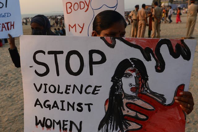 Members of NGO 'Aastha' hold placards during an anti-rape protest in Mumbai