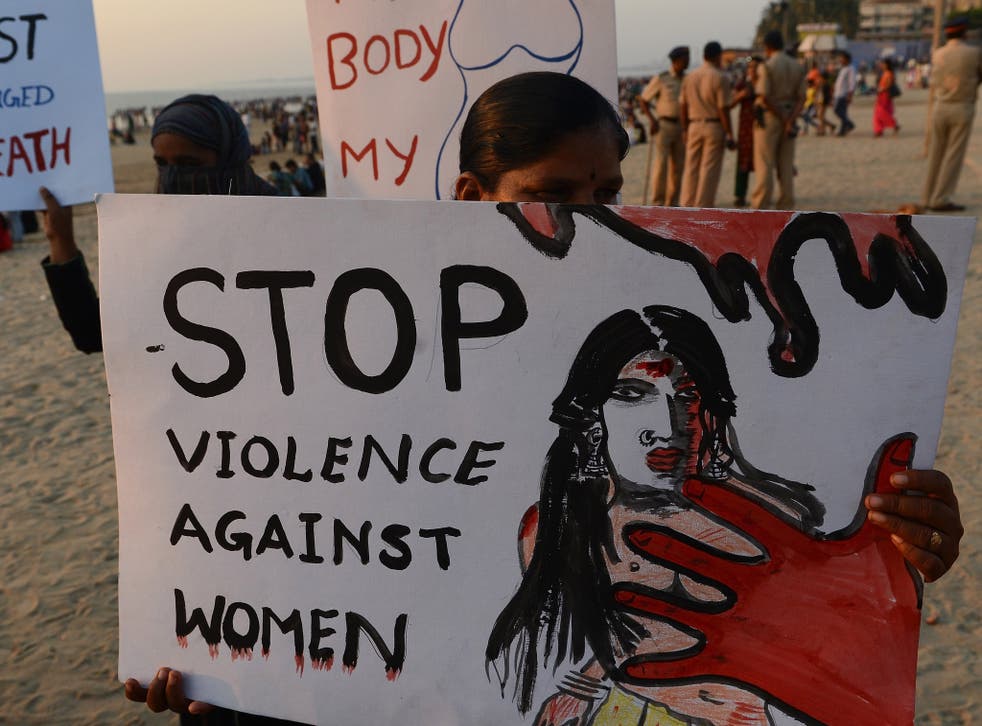 Members of NGO 'Aastha' hold placards during an anti-rape protest in Mumbai