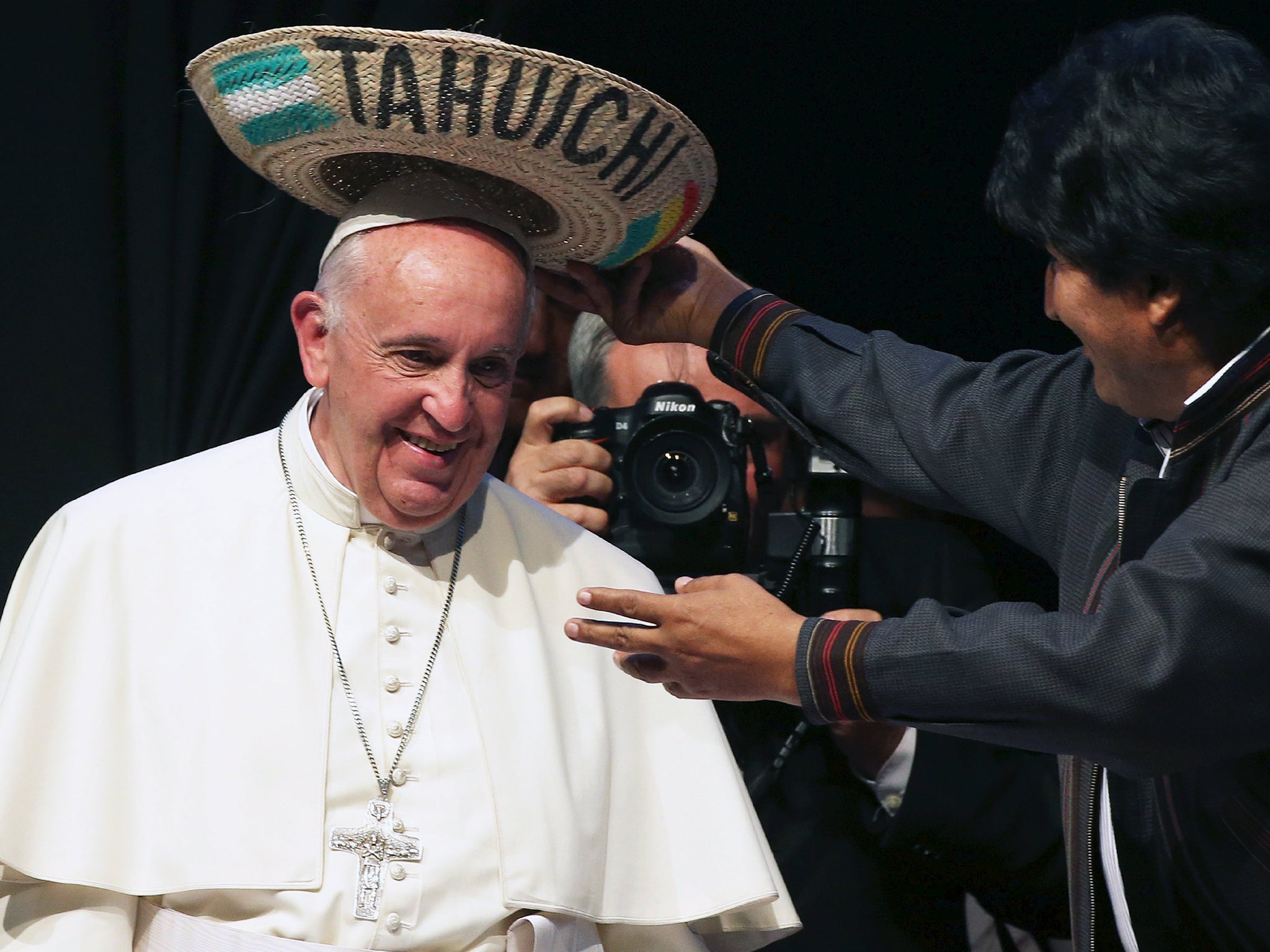 Pope Francis receives a typical sombrero from Bolivian President Evo Morales during a World Meeting of Popular Movements in Santa Cruz, Bolivia. The word "Tahuichi" is from the Tupi-Guarani and means "Big Bird"