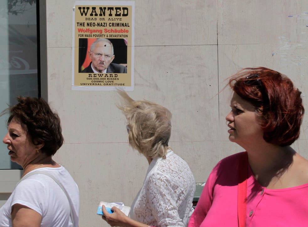 A poster depicts the German Finance Minister Wolfgang Schäuble as a Neo-Nazi in Athens