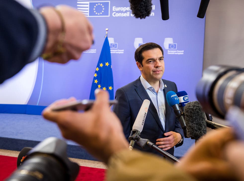 Greek Prime Minister Alexis Tsipras speaks with the media after a meeting of eurozone heads of state at the EU Council building in Brussels