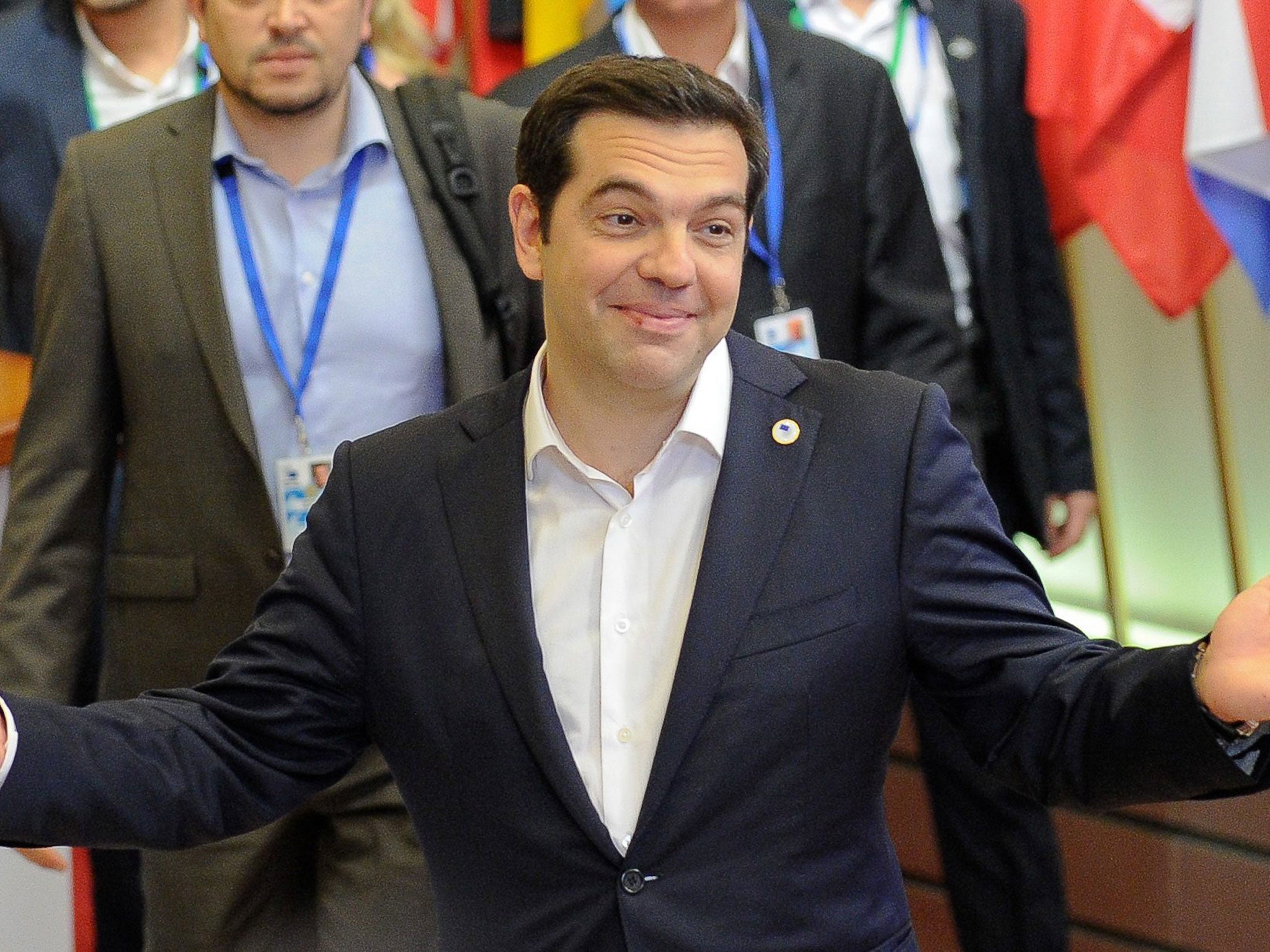 Greek Prime Minister Alexis Tsipras leaving at the end of an Eurozone summit at the European Council headquarters in Brussels