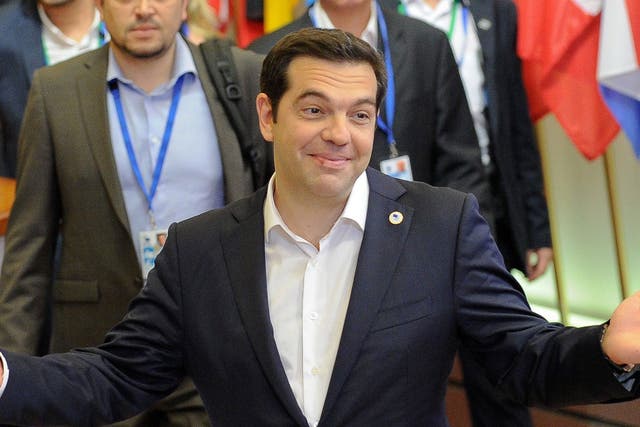 Greek Prime Minister Alexis Tsipras leaving at the end of an Eurozone summit at the European Council headquarters in Brussels