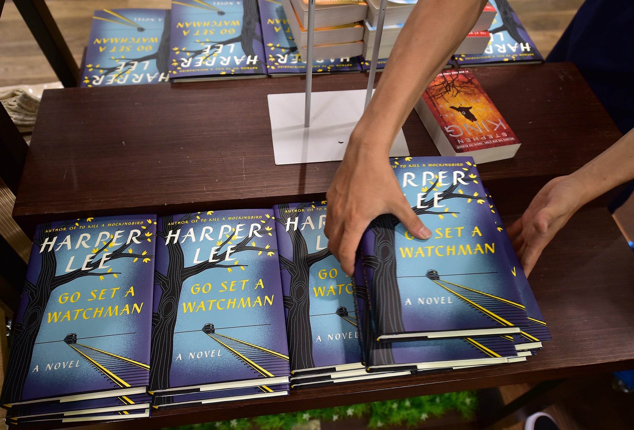 A South Korean bookseller lays out copies of Harper Lee's Go Set A Watchman