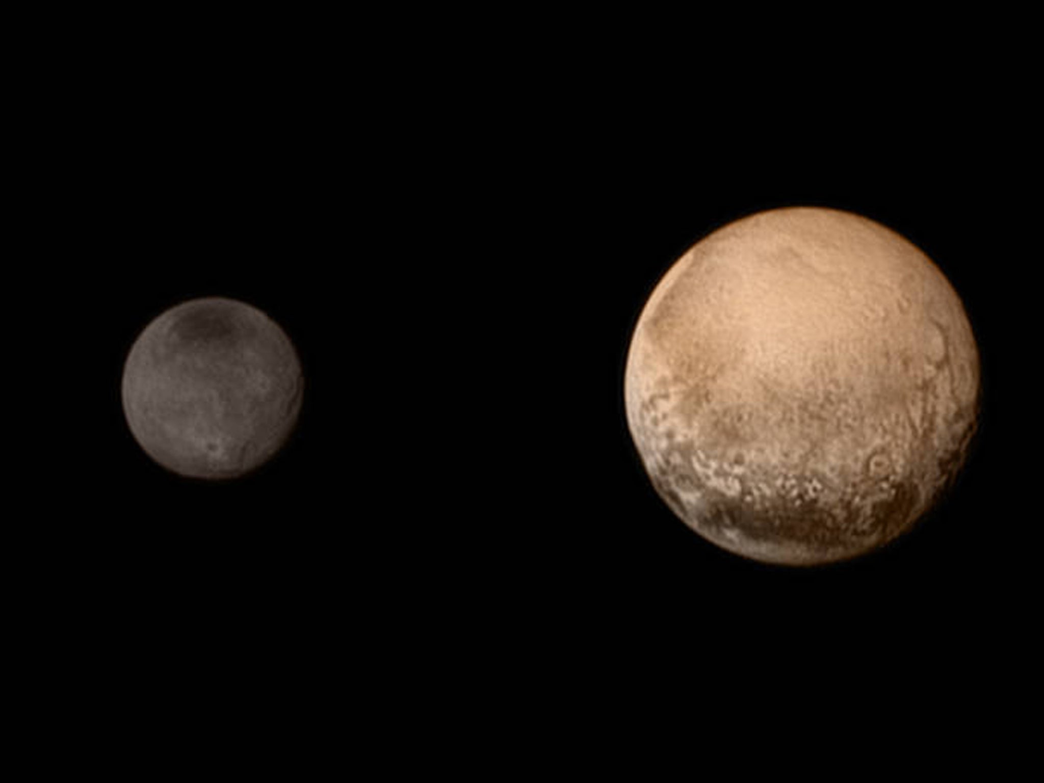 A portrait from the final approach - Pluto and Charon display striking color and brightness contrast