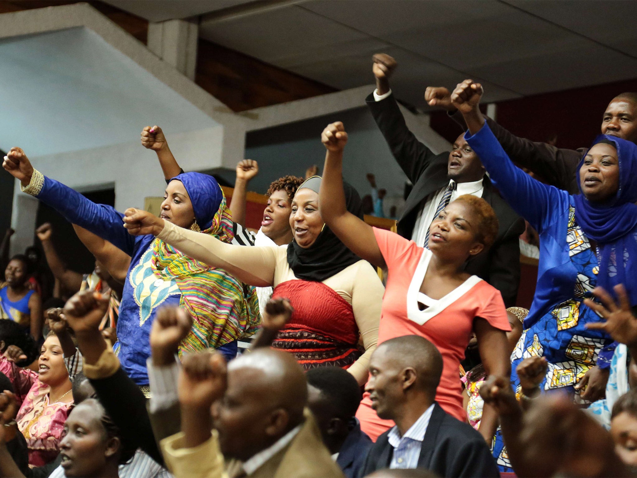 Kagame supporters celebrate after hearing MPs had backed a petition to overturn the two-term presidency limit (Getty)