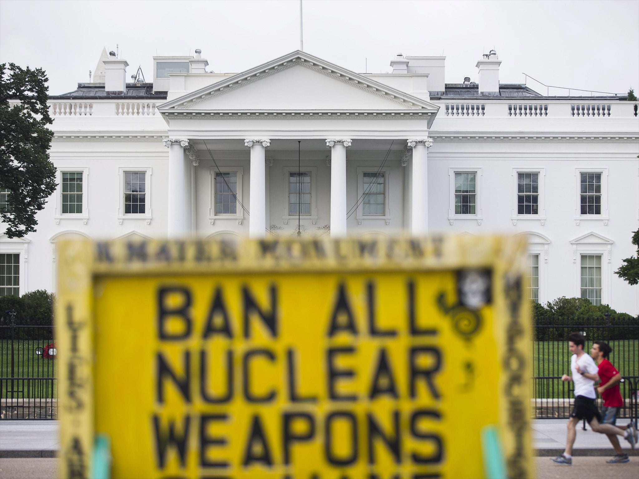 A protester's sign is seen outside the White House on Tuesday
