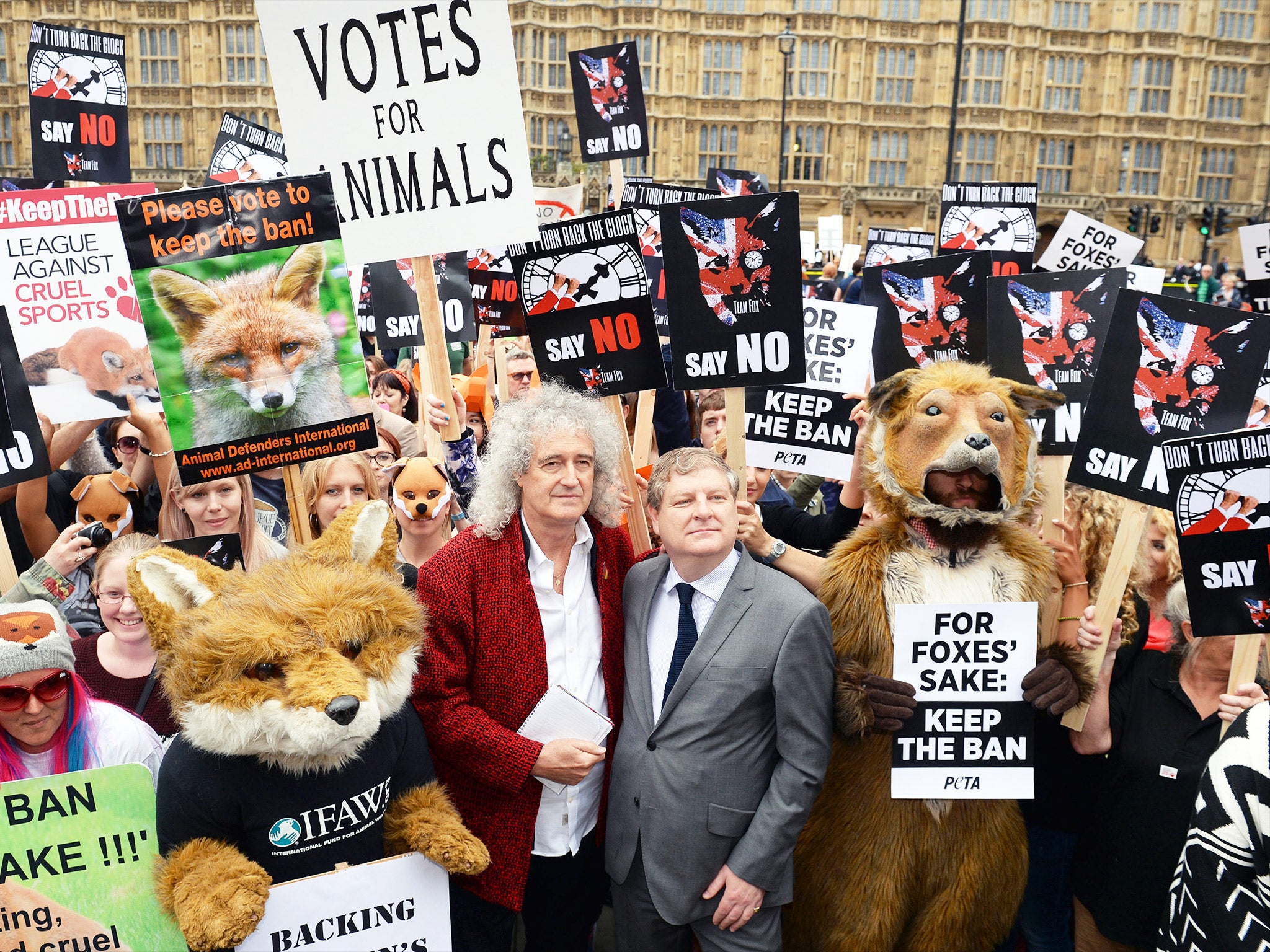 Brian May joins SNP MP Angus Robertson and anti-foxhunting protesters outside the Houses of Parliament