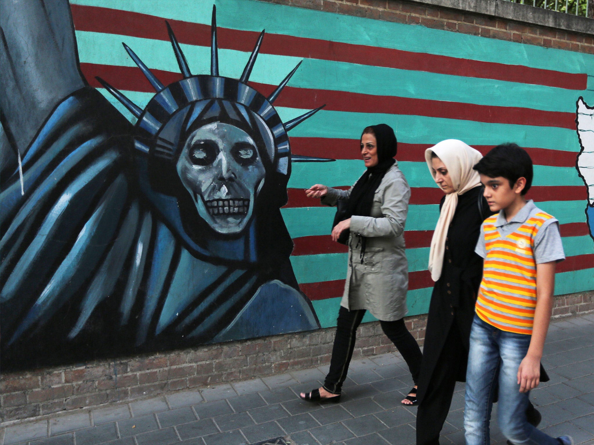 Anti-US graffiti on the wall of the former US embassy in Tehran (Getty)