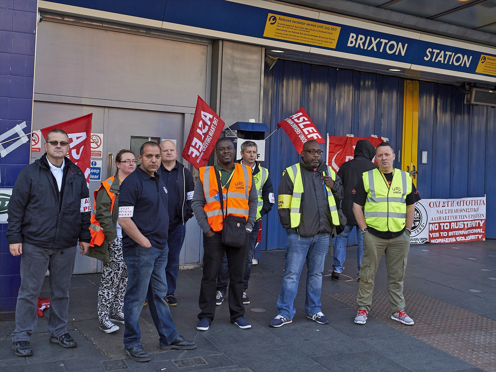 Protesters from the ASLEF and RMT unions stand at the locked gates of Brixton underground station during last Thursday's tube strike