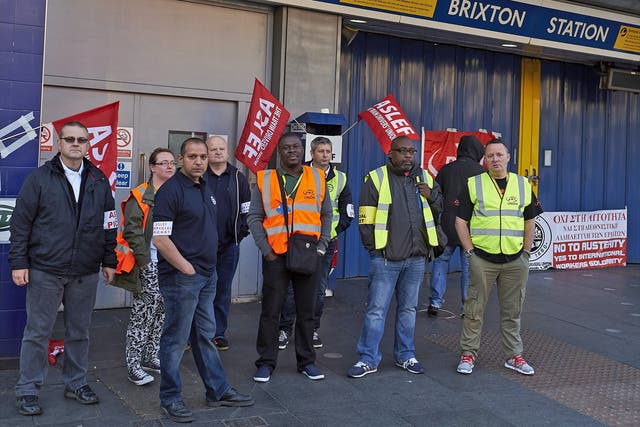 Protesters from the ASLEF and RMT unions stand at the locked gates of Brixton underground station during last Thursday's tube strike
