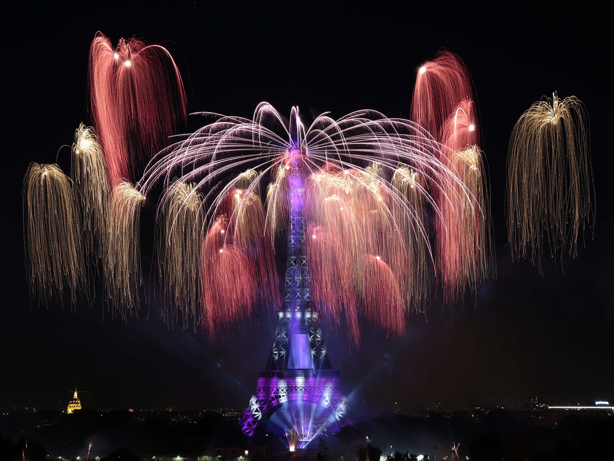 Colourful fireworks light skies above the Eiffel Tower