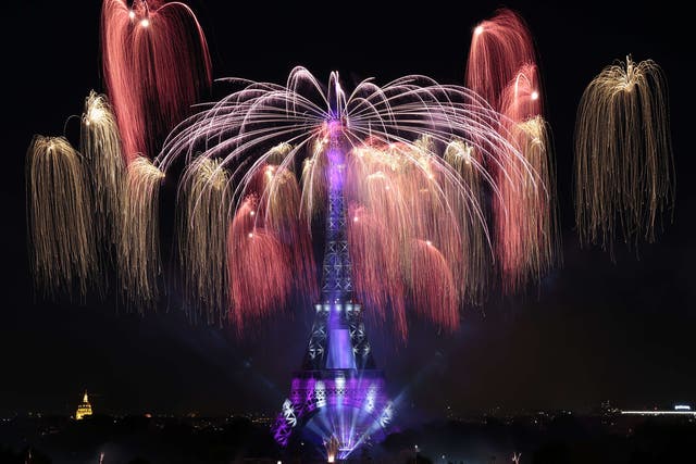 Colourful fireworks light skies above the Eiffel Tower