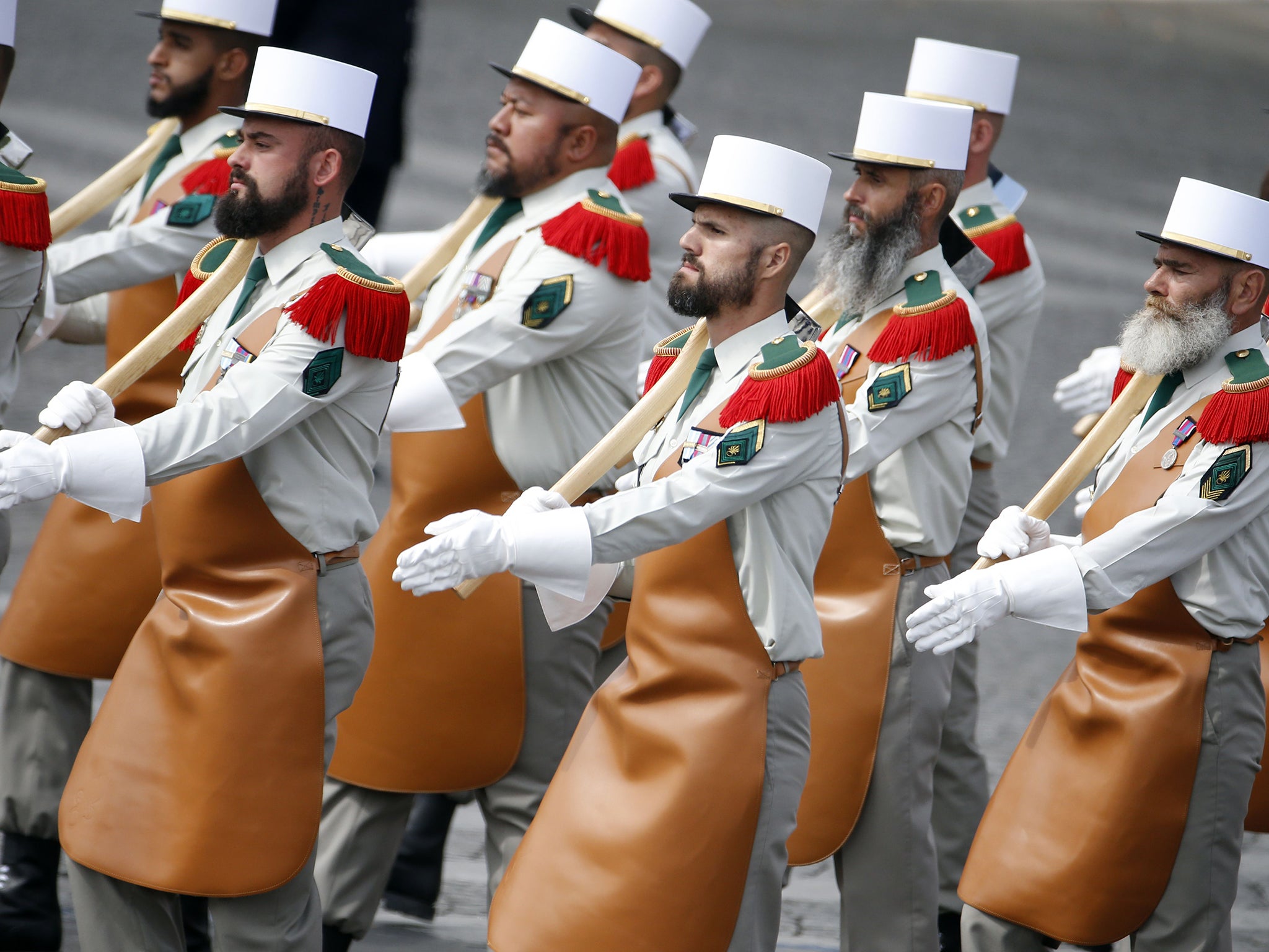 Troops of the Pionniers du 1er Regiment Etranger (Pioneers of the first regiment of the Foreign Legion) march down the Champs Elysees