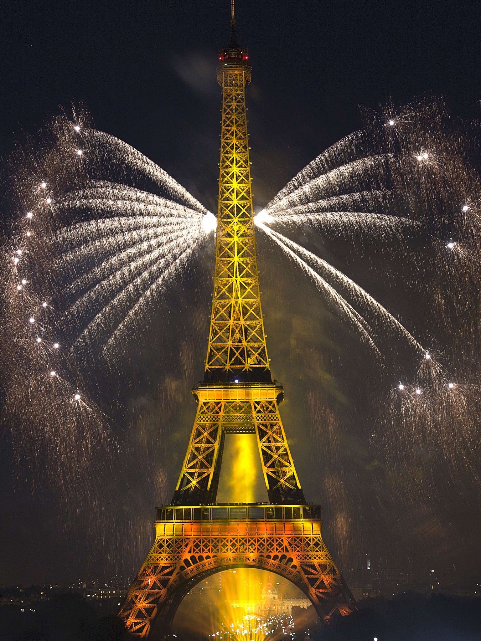 Fireworks light the skies above the Eiffel Tower as part of France's annual Bastille Day celebrations