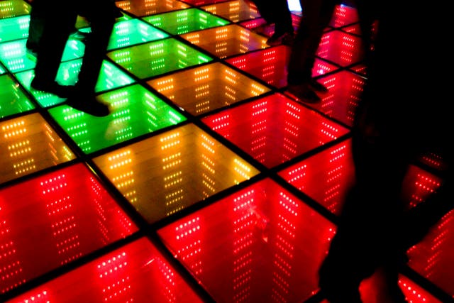 Best foot forward: revellers make the most of a dance floor lit by their steps