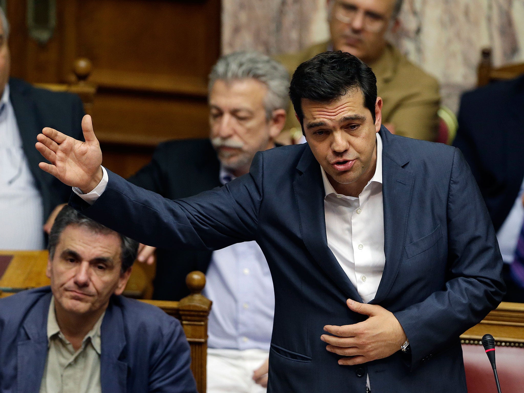 Prime Minister, Alexis Tsipras, delivers a speech during the meeting in the Greek parliament