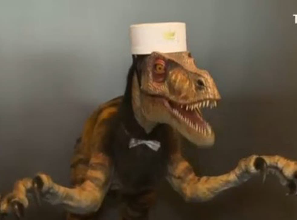 An English-speaking dinosaur receptionist is the future... in Japan
