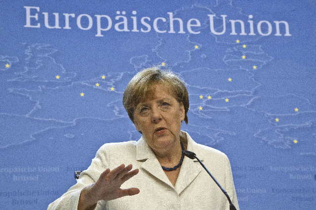 German Chancellor Angela Merkel speaks during a media conference after a meeting of eurozone heads of state at the EU Council building in Brussels on Monday, July 13, 2015