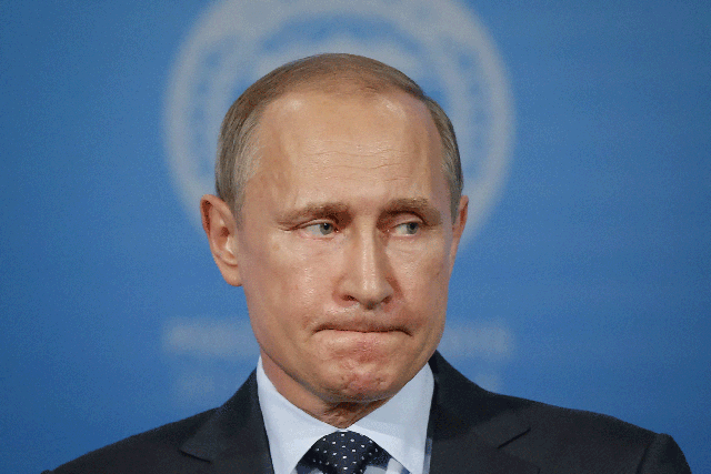 Vladimir Putin looks on at a news conference after the Shanghai Cooperation Organization (SCO) summit in Ufa, Russia, July 10, 2015