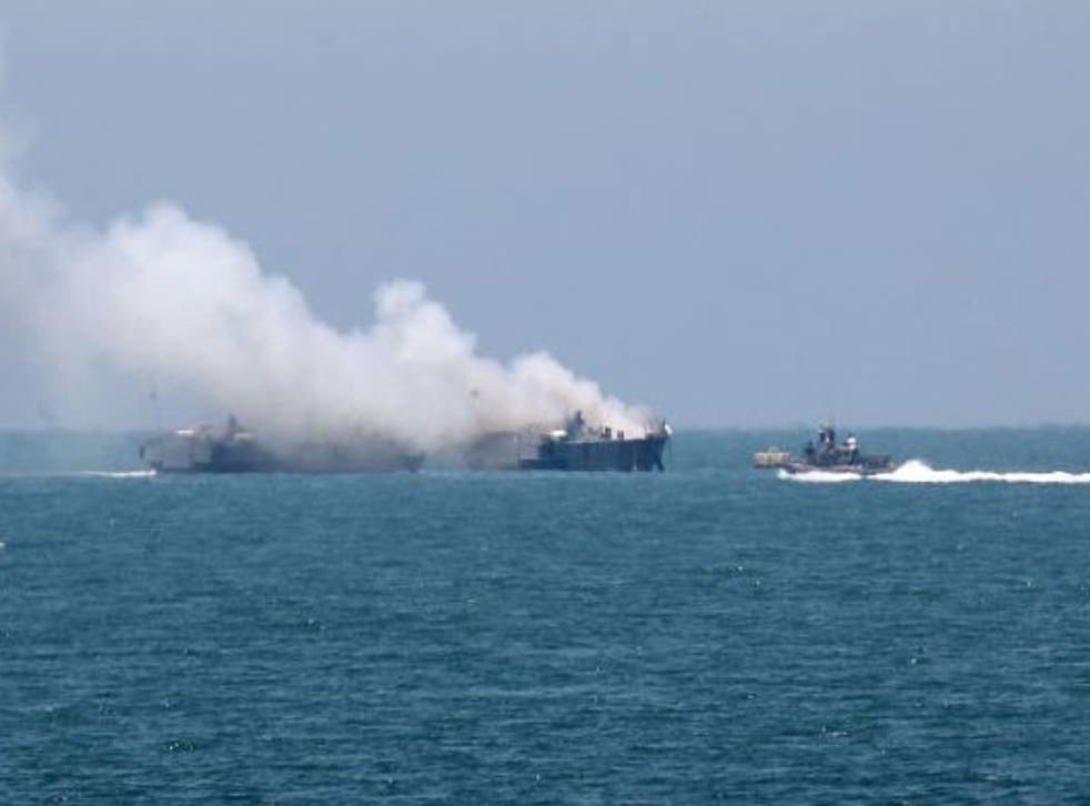 Smoke rises from the Egyptian navy ship after an apparent rocket attack purportedly launched by Isis-linked militants