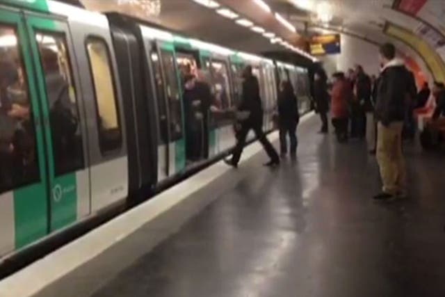 Chelsea fans are shown stopping Souleymane Sylla from boarding a Paris Metro train