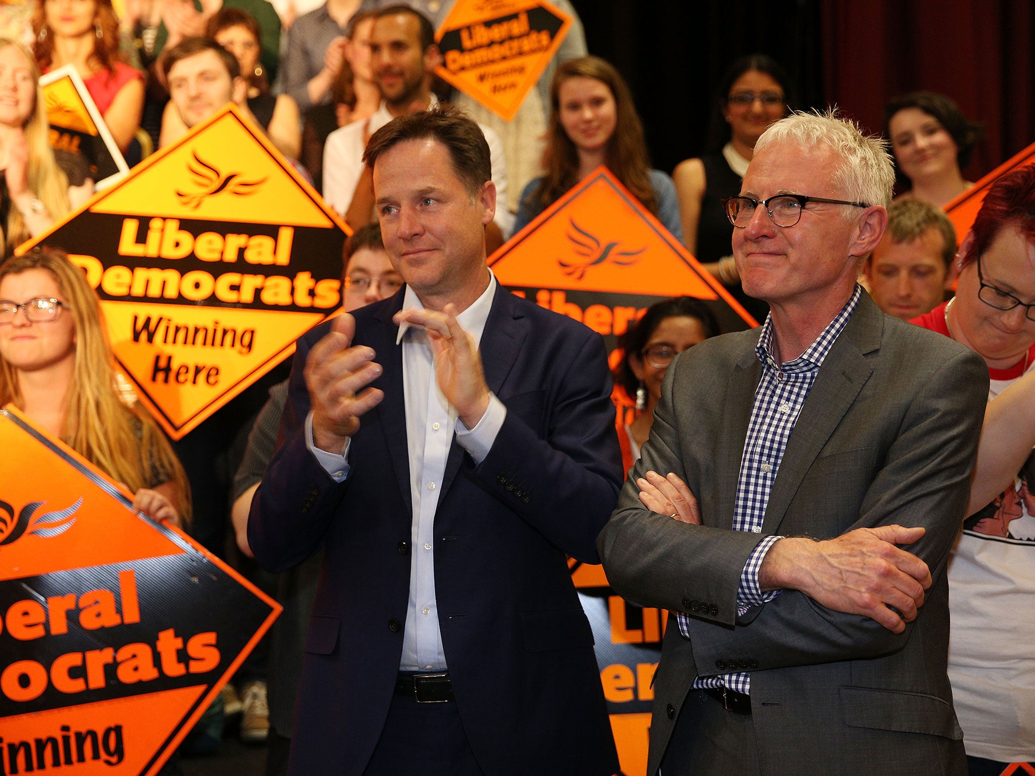 Tim Farron's predecessor, Nick Clegg, and his leadership rival, Norman Lamb, greet his victory