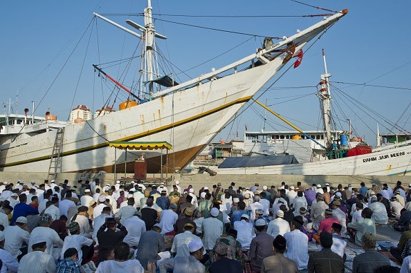 Indonesia's Muslim community flocks to the Sunda Kelapa port in Jakarta for Eid prayers (via ROMEO GACAD/AFP/Getty Images)