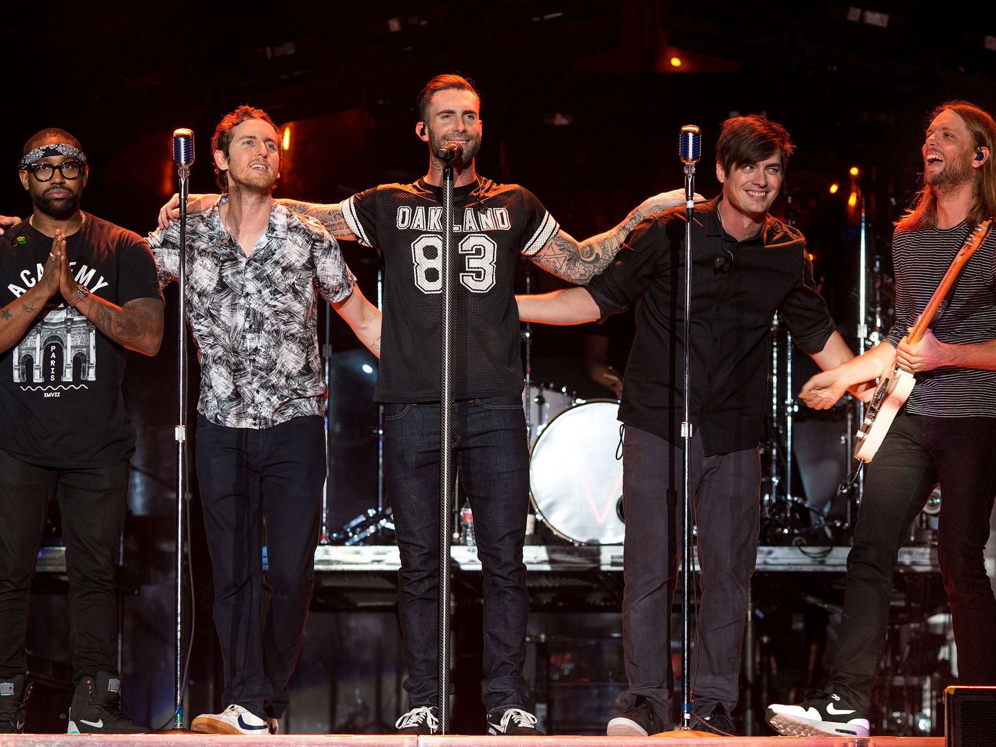 Jesse Carmichael (second from right) performs with Maroon 5