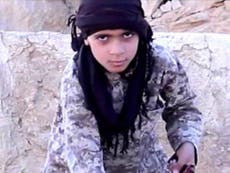 Isis video shows young boy beheading Syrian soldier