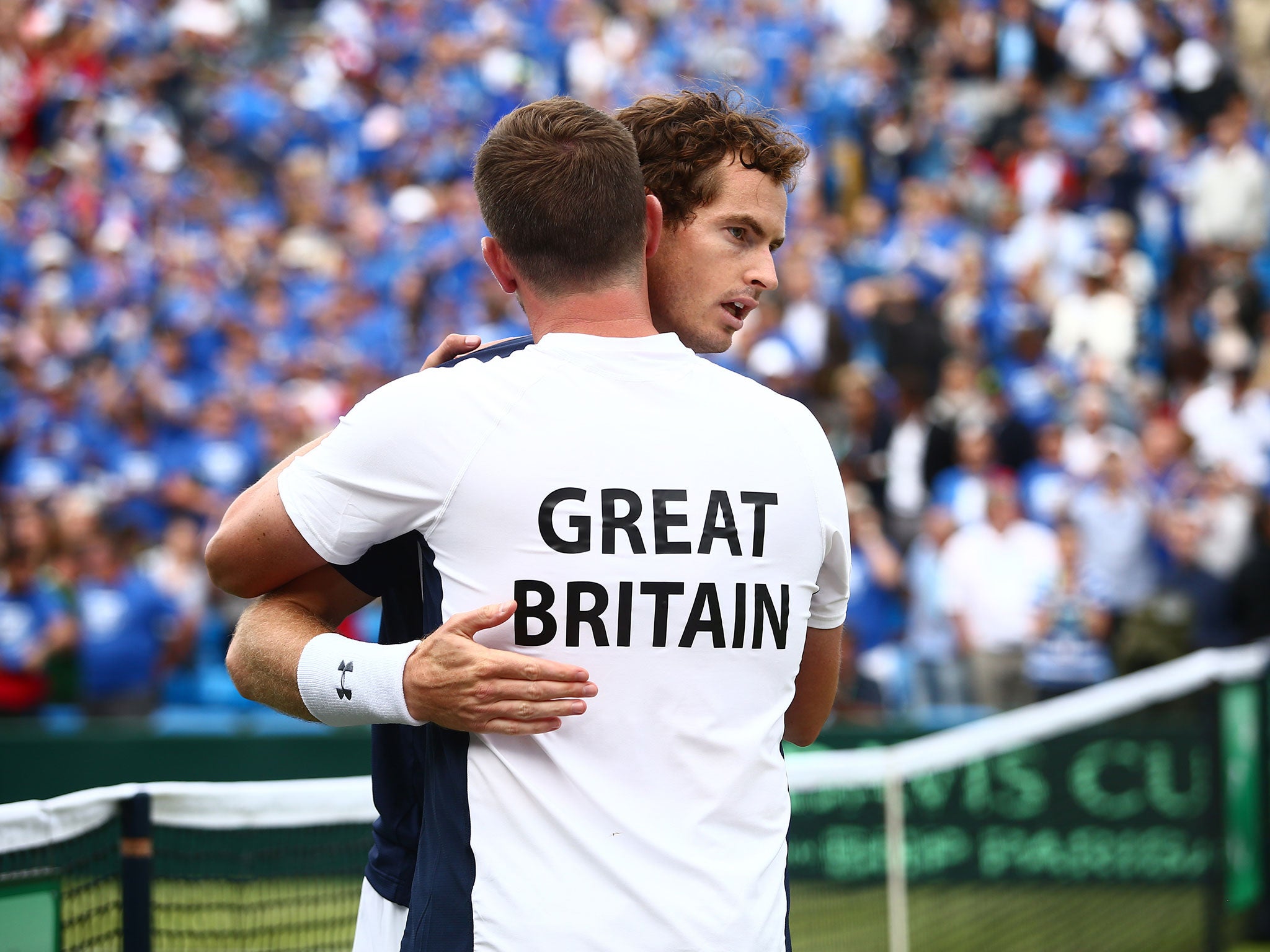Andy Murray celebrates with captain Leon Smith after winning his match against Jo-Wilfried Tsonga of France during Day One of the World Group Quarter Final Davis Cup