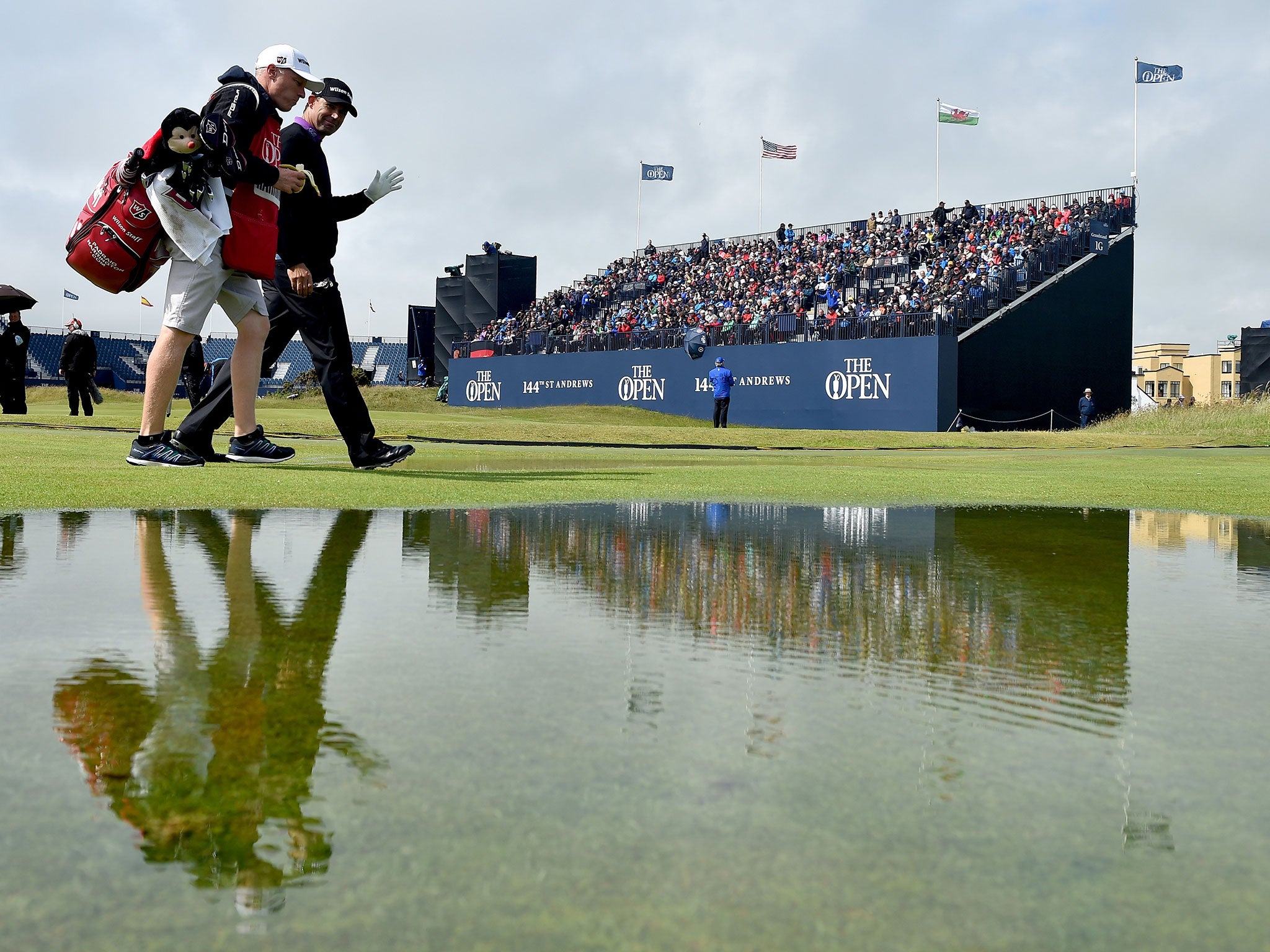 Padraig Harrington out on course following the deluge