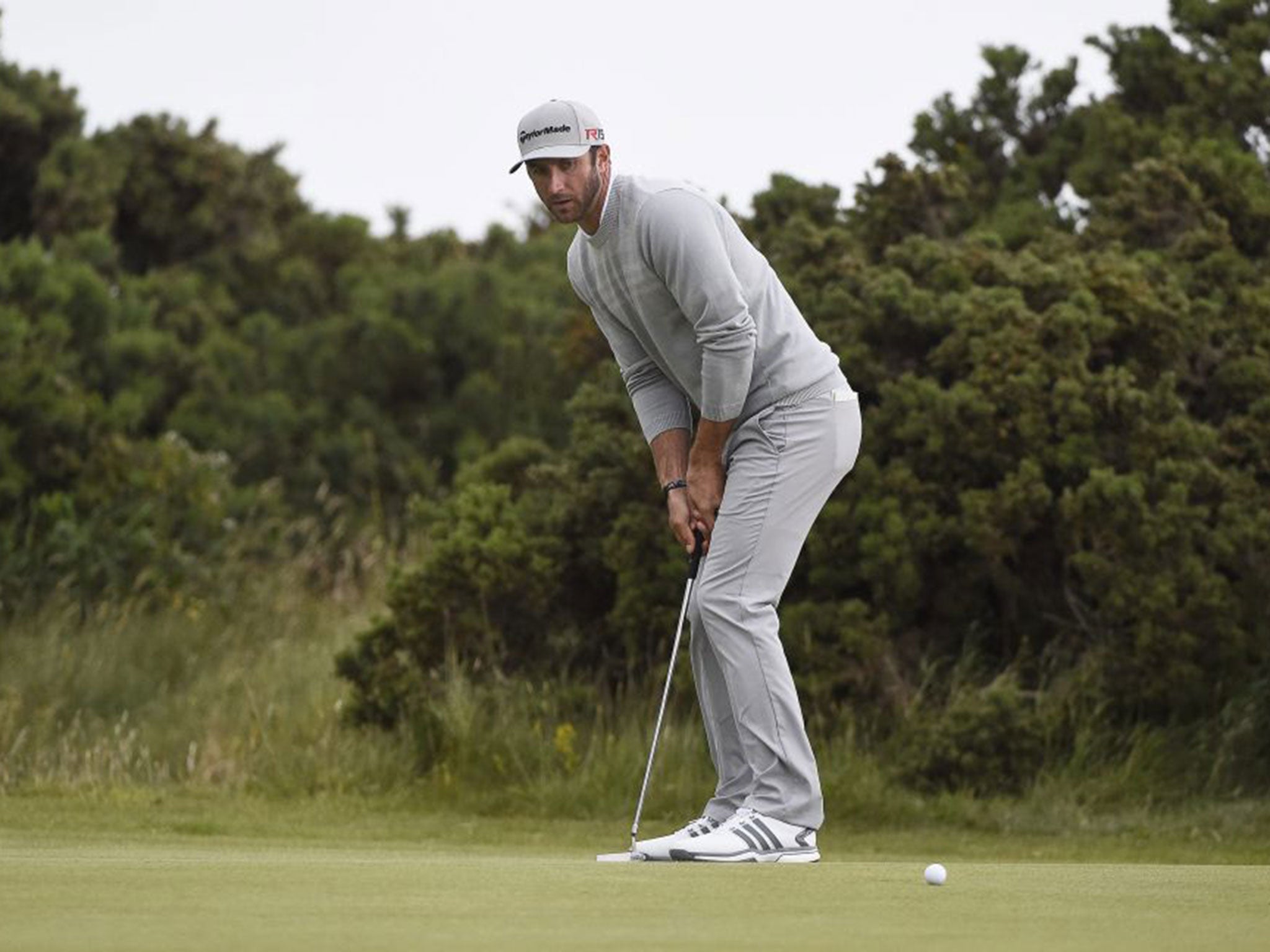 Dustin Johnson from the USA plays a shot on the green during the second day of the British Open Golf Championship at St. Andrews 