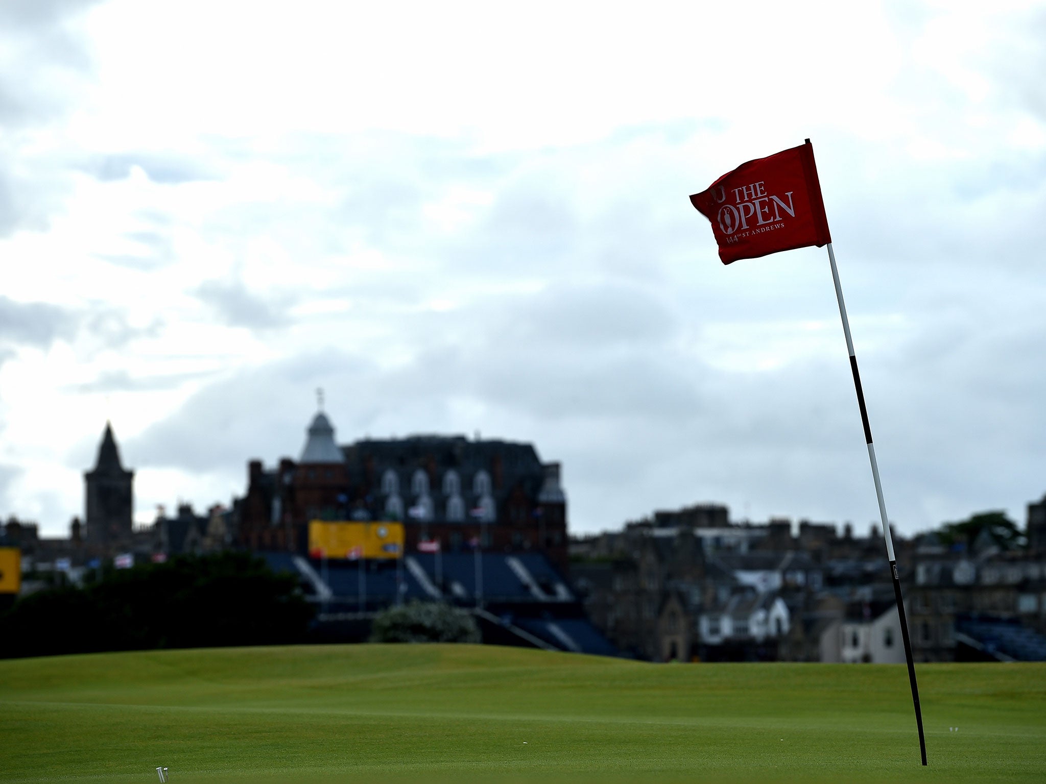 A flag bows in the wind as play is suspended