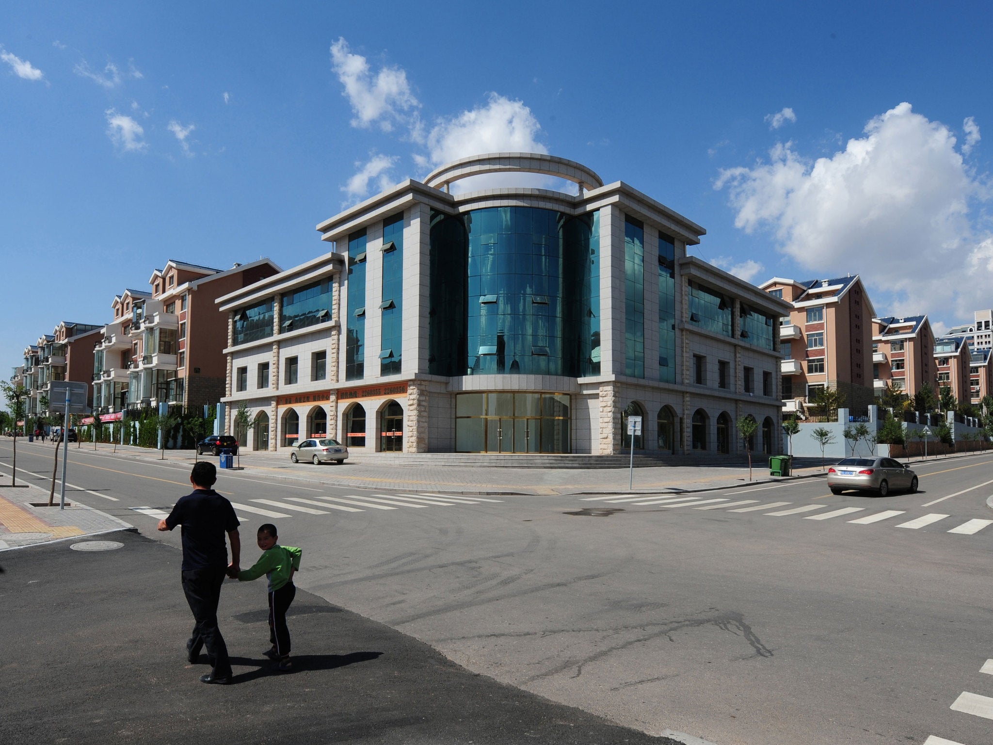 The group were arrested in Ordos, which has been dubbed a 'ghost town' because of its lack of residents and empty buildings and streets