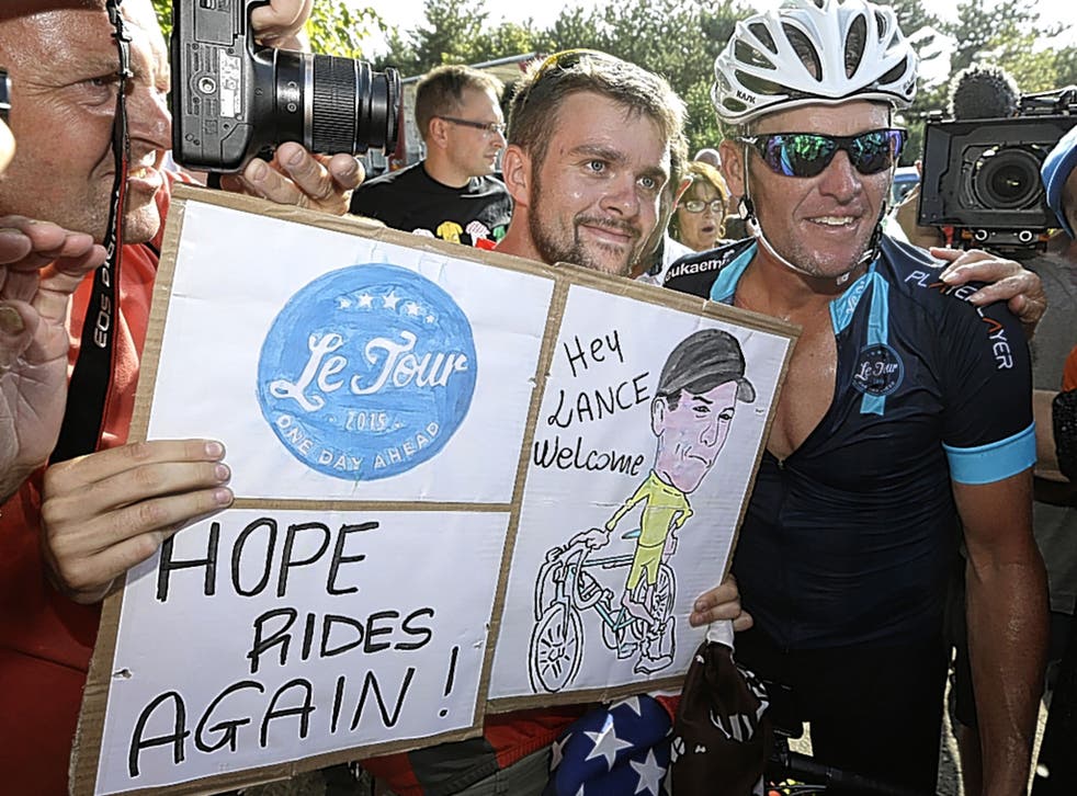 Armstrong finds his fans as he returns to France last week but his charity ride has generated suspicion