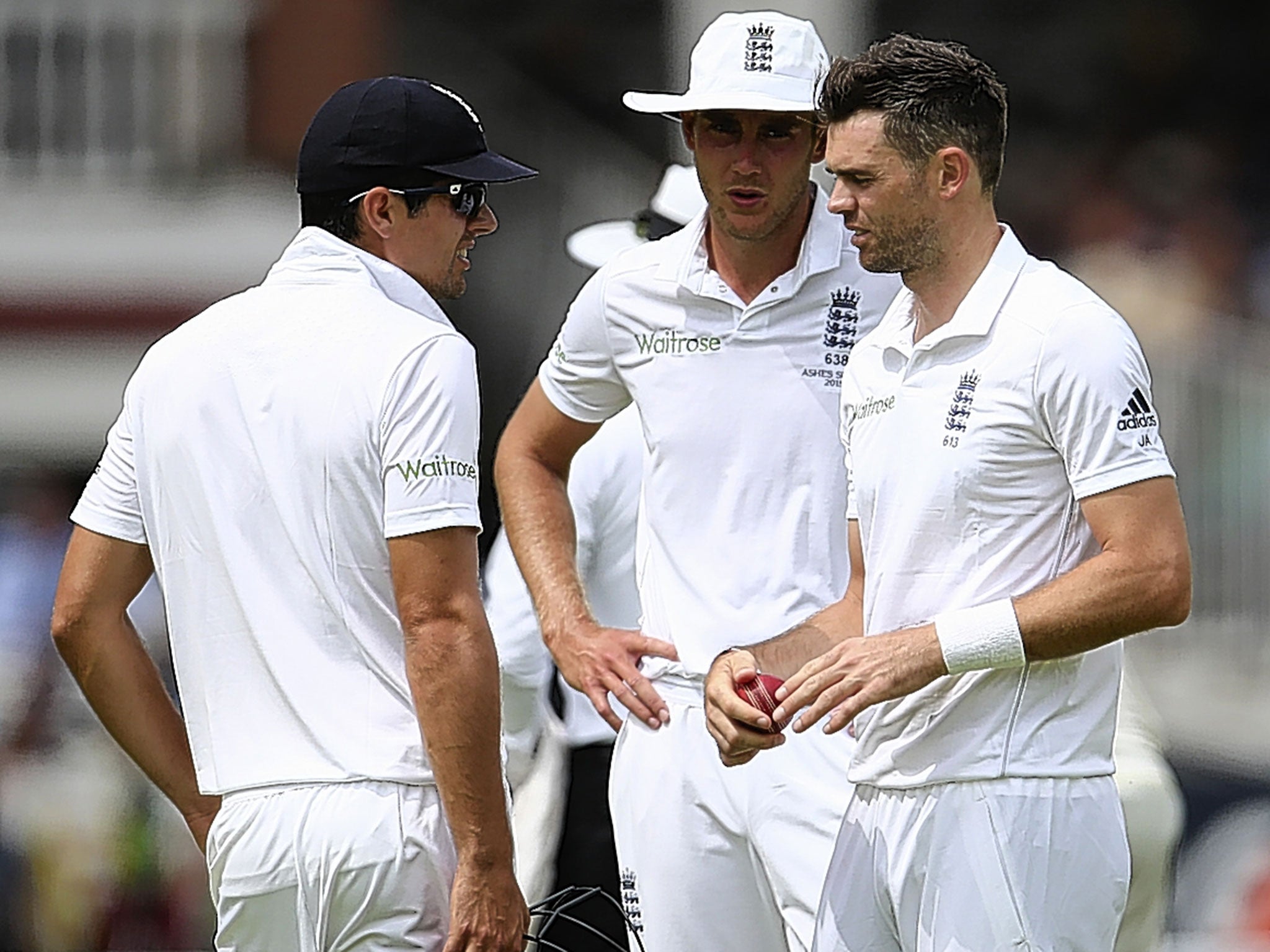 Captain Alastair Cook (left) in discussion with James Anderson and Stuart Broad as Australia pile on the runs on a shirtfront track at Lord’s