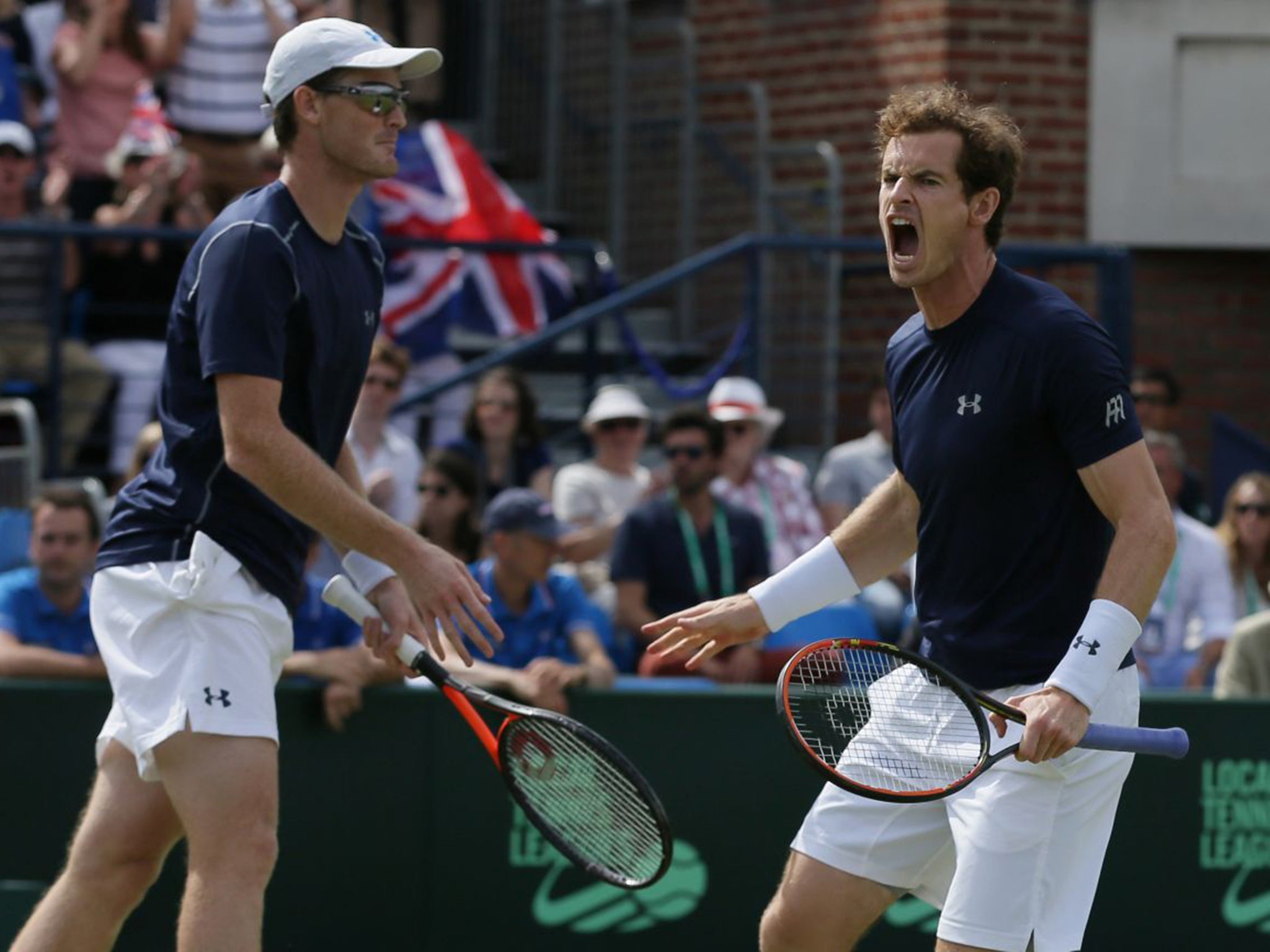 In with a shout: Andy Murray, right, and brother Jamie during their victory