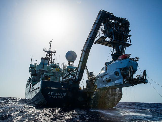 The research vessel Atlantis is shown off the coast of the Carolinas in the Atlantic Ocean with the submersible Alvin hanging off its stern. The expedition led by Duke University marine scientist Cindy Van Dover has found a shipwreck that may date back to