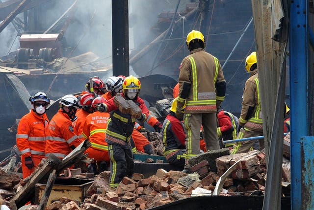 Search and rescue teams from all emergency services search the scene of an explosion and fire at Wood Flour Mills, Bosley, Cheshire