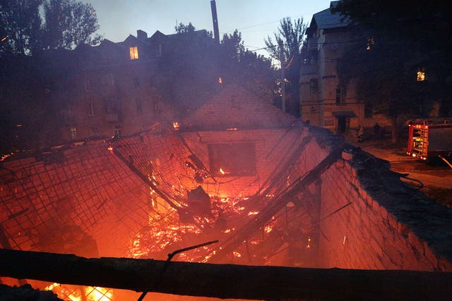 A building burns after the shelling between Ukrainian forces and pro-Russian separatists in the eastern Ukrainian city of Donetsk 