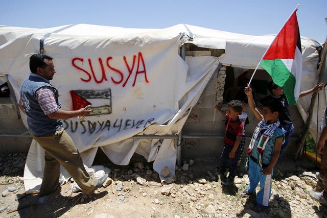 Palestinians protest against Israeli plans to demolish their village