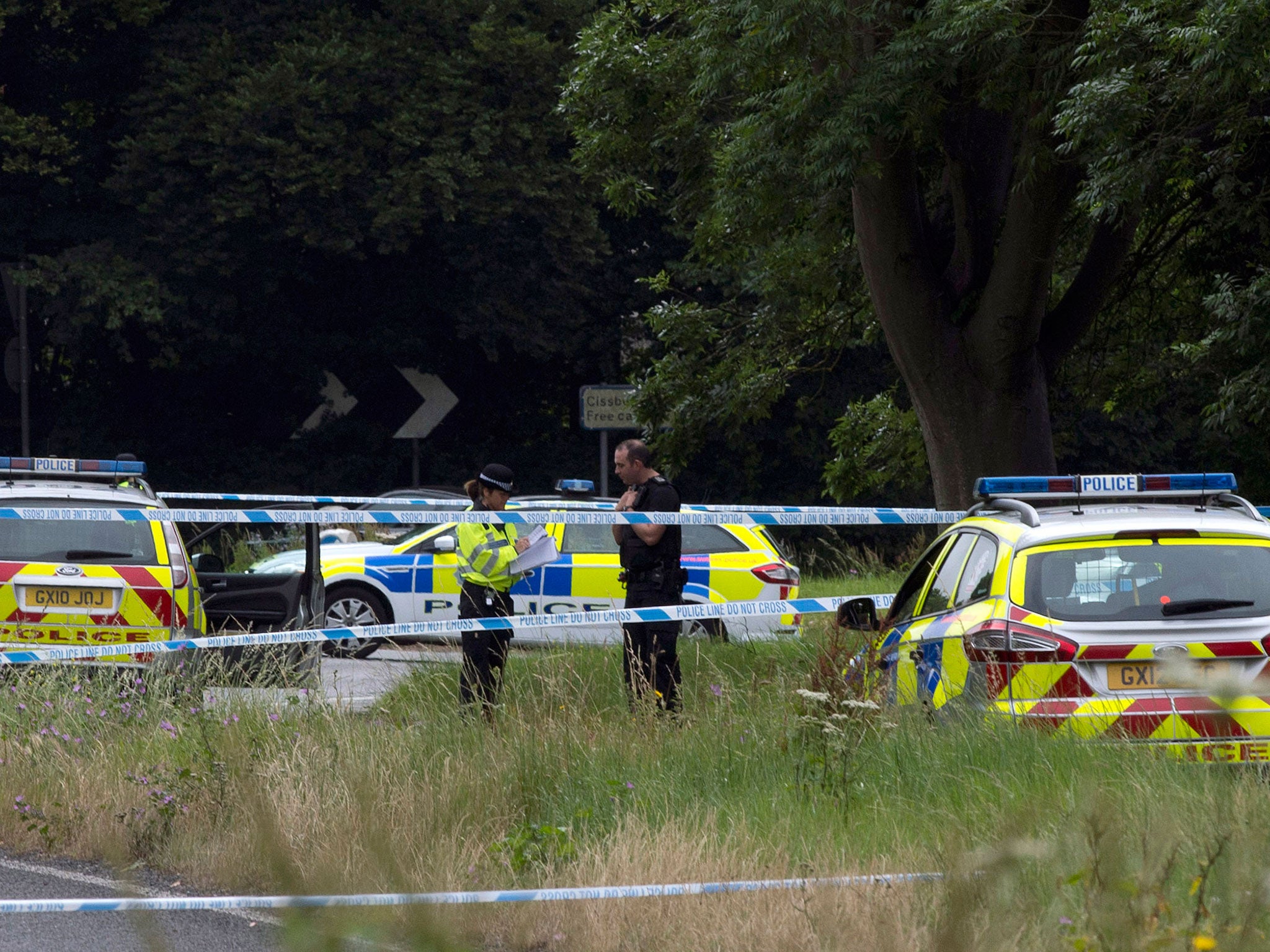 Police close to the scene where Donald Lock was stabbed to death in Findon, West Sussex