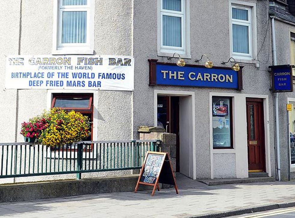 The shop proudly displays a banner saying “Birthplace of the world famous deep fired mars bar” on the front of its premises