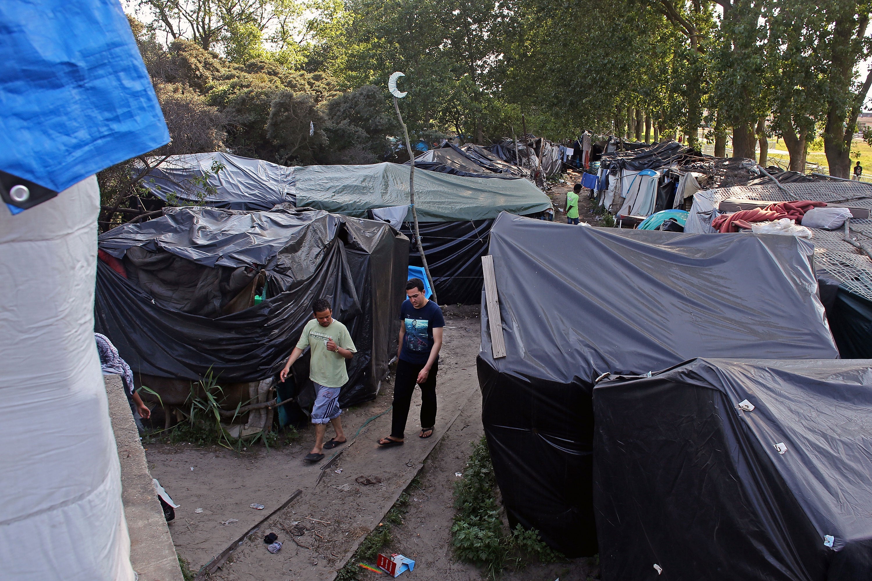 An open air shanty town known as “the new jungle” is home to around 2,000 migrants from across the world