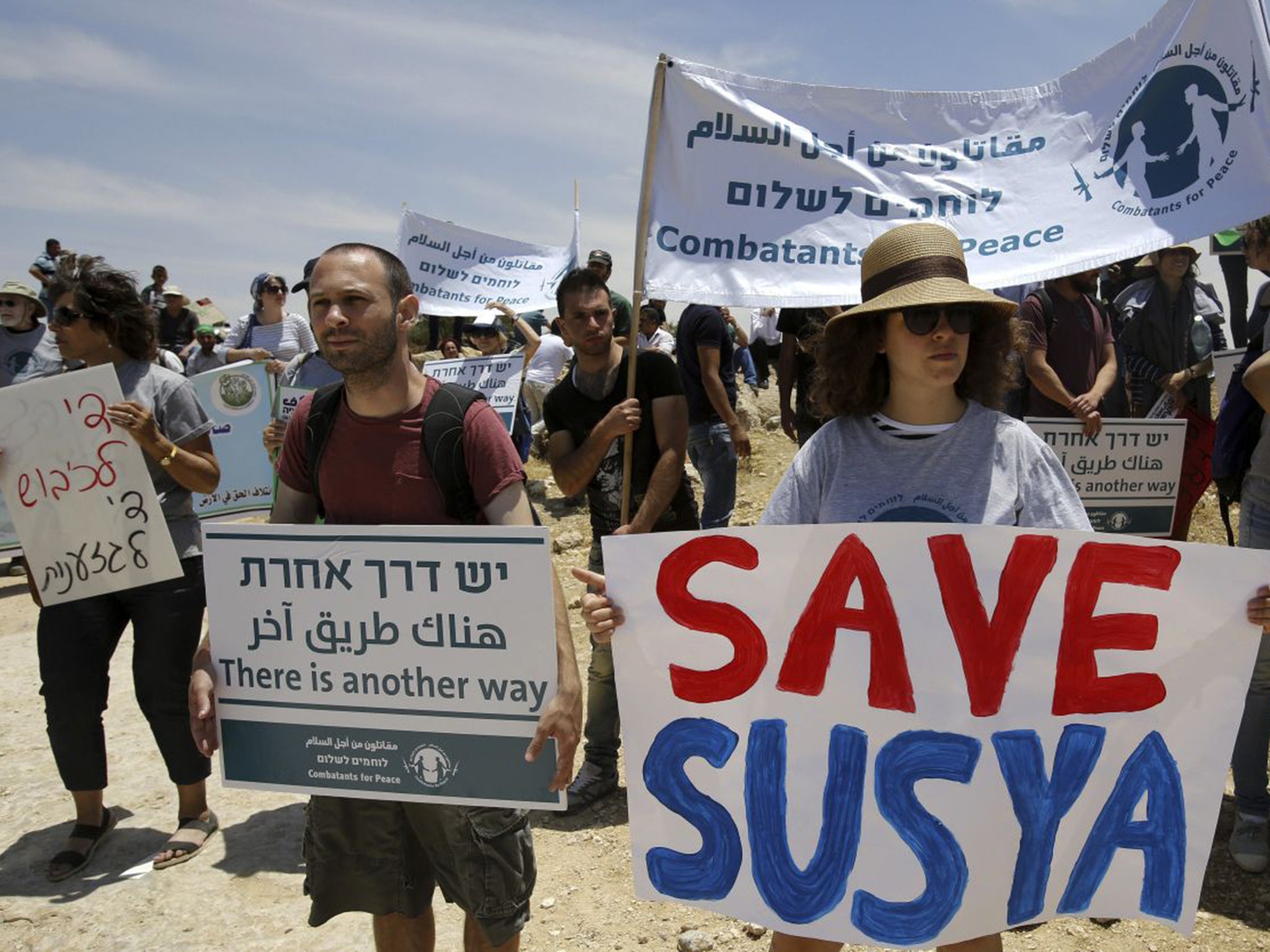 Peace activists protest the demolition of Susiya