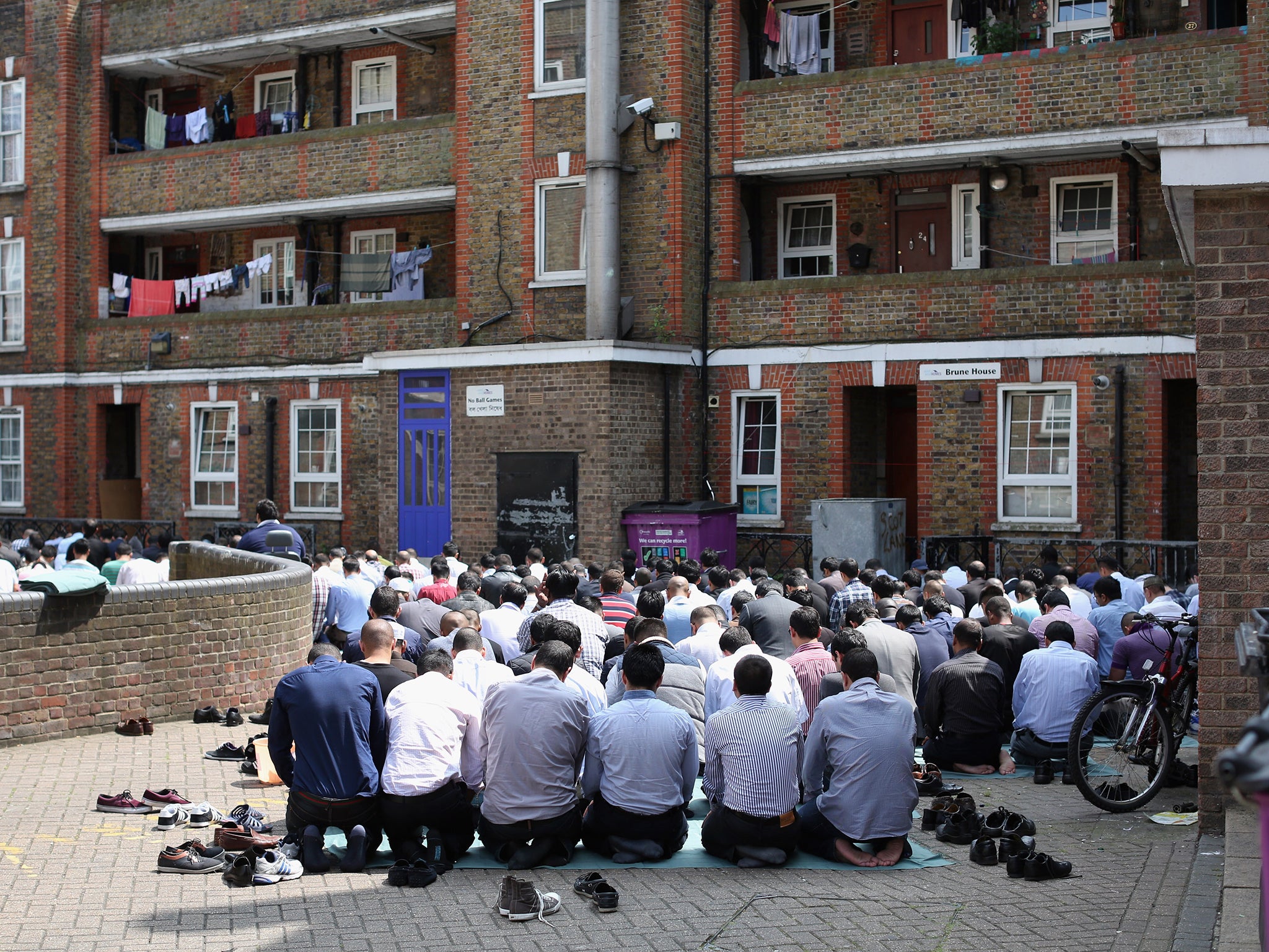 Muslims perform the Friday prayer during Ramadan on the Brune Estate in London in 2013. David Cameron acknowledged many young Muslims feel alienated from wider British society