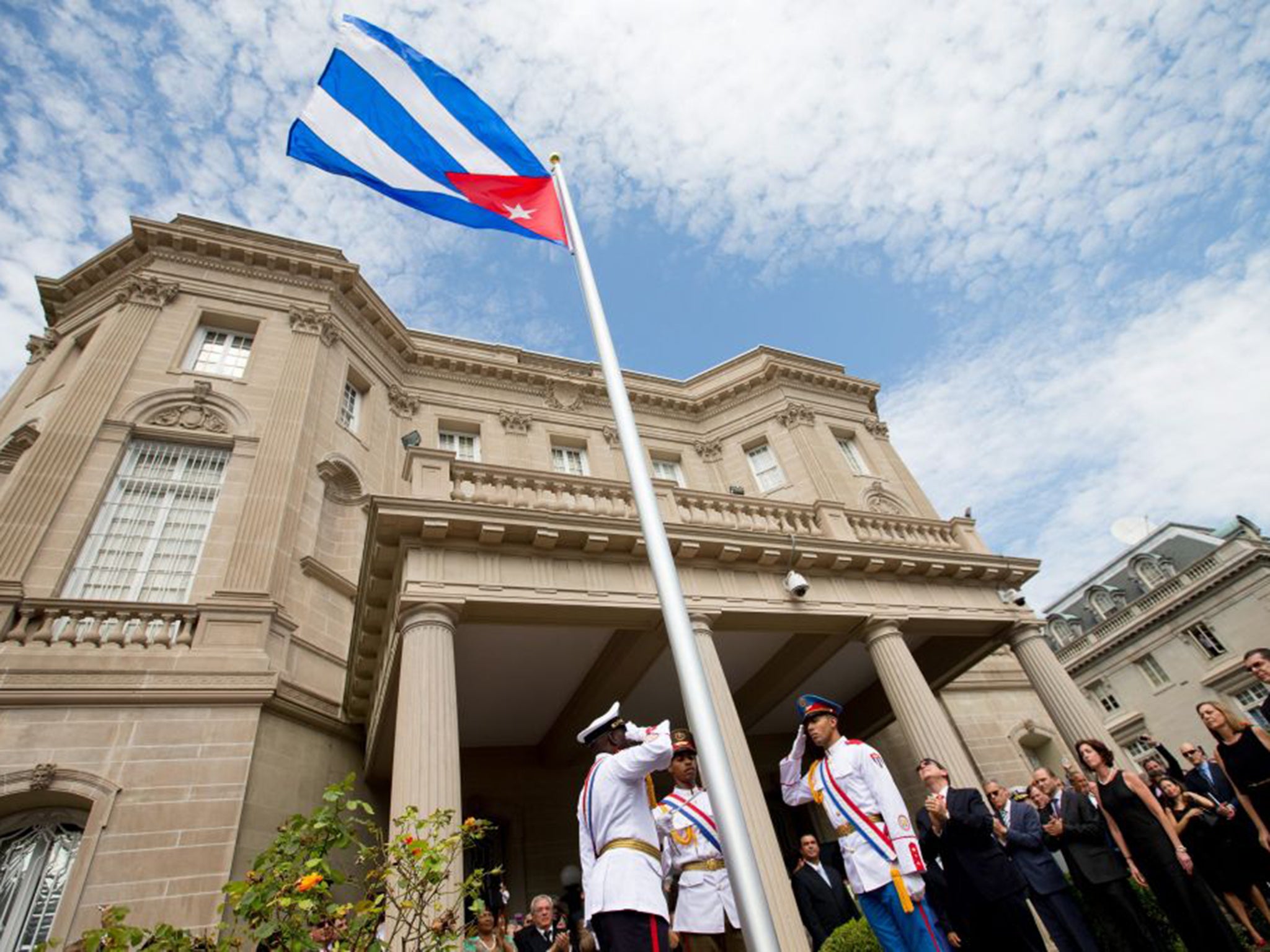 The Cuban flag is raised over its new embassy in Washington DC on Monday