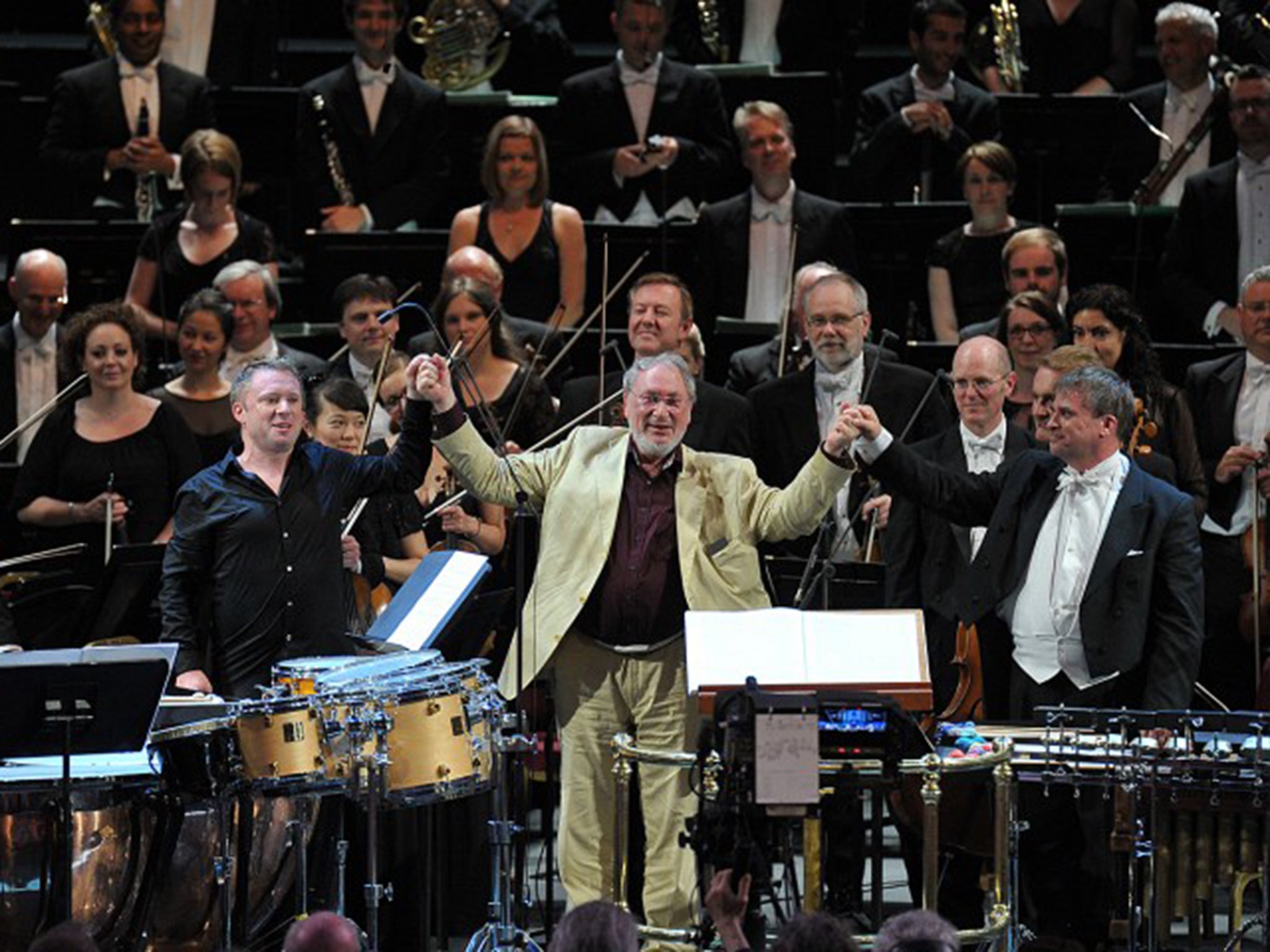 From left to right: percussionist Colin Currie, composer HK Gruber and conductor John Storgårds take a bow following the world premiere of HK Gruber's 'into the open...' at the BBC Proms on Monday 20 July